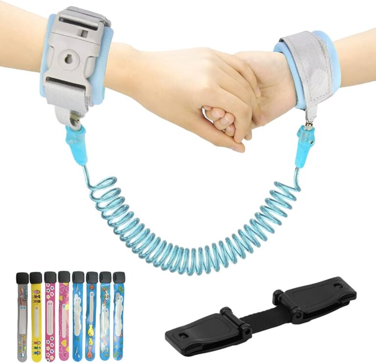 KidSafe OnceLock Wristband with a coiled, blue tether connecting two adjustable wrist cuffs. The wristbands have secure, child-proof locks to prevent accidental release. The image also shows colorful replacement straps in various designs and a black attachment buckle.