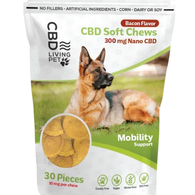 CBD Living Pet CBD Soft Chews for dogs in bacon flavor, featuring 300 mg Nano CBD for mobility support. Pack of 30 pieces with 10 mg per chew. Product highlights include no fillers, artificial ingredients, corn, dairy, or soy, and icons for cruelty-free, vegan, gluten-free, THC-free, and made in the USA. Image of a German Shepherd on the packaging.