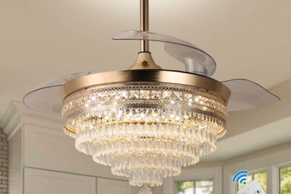 Gold crystal chandelier ceiling fan with retractable blades, shown with a remote control for operation.