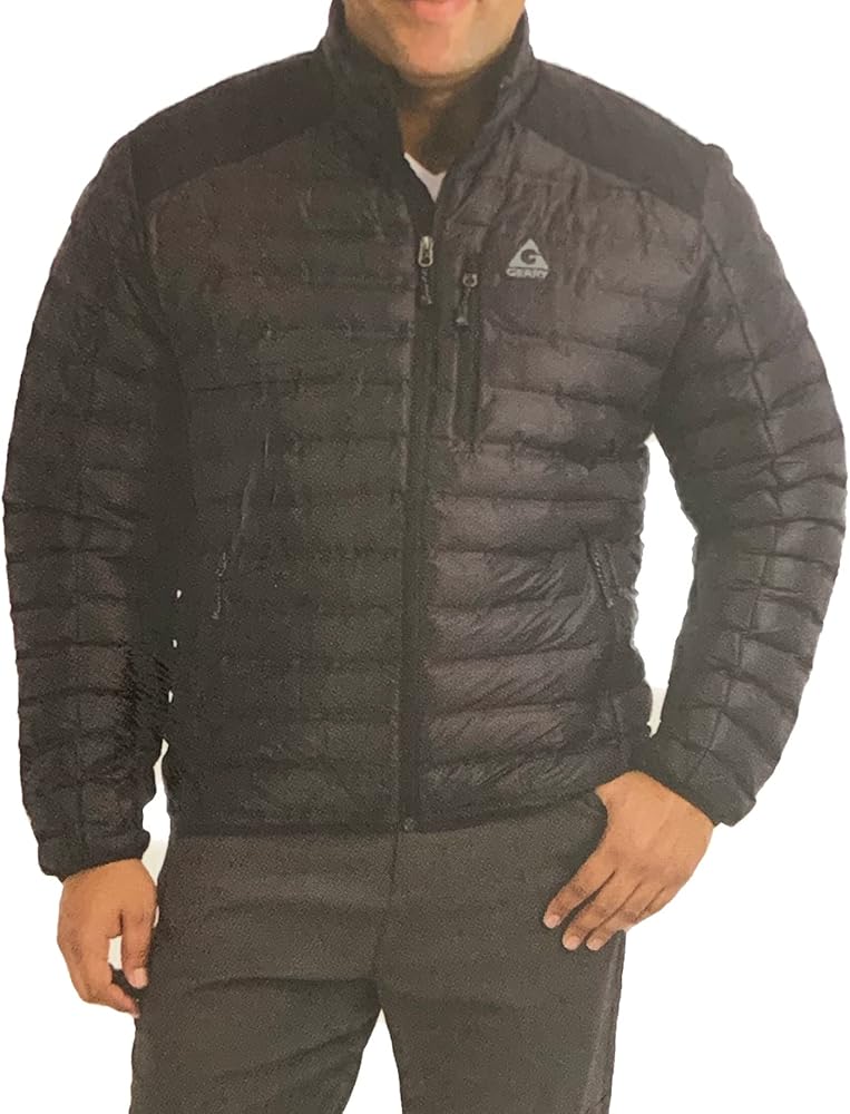 Man wearing a black quilted Gerry Jacket with a zippered front and high collar, designed for cold weather.