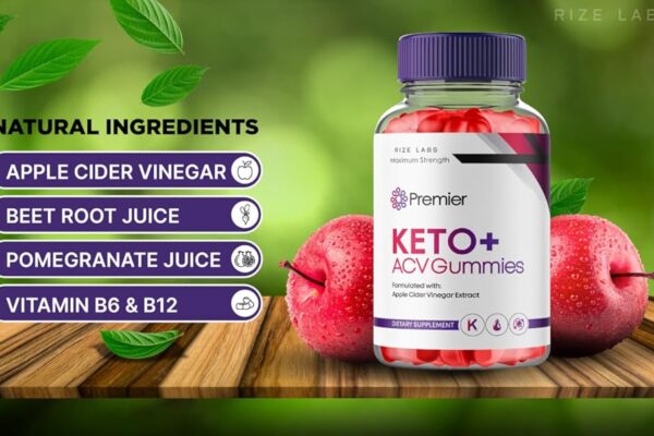 Image of a product titled 'Premier Keto+ ACV Gummies' by Rize Labs, featuring a bottle of gummies with a purple cap and red gummies inside. The image highlights natural ingredients including apple cider vinegar, beetroot juice, pomegranate juice, and vitamins B6 & B12. The background shows fresh apples and green leaves on a wooden surface with a blurred green backdrop.