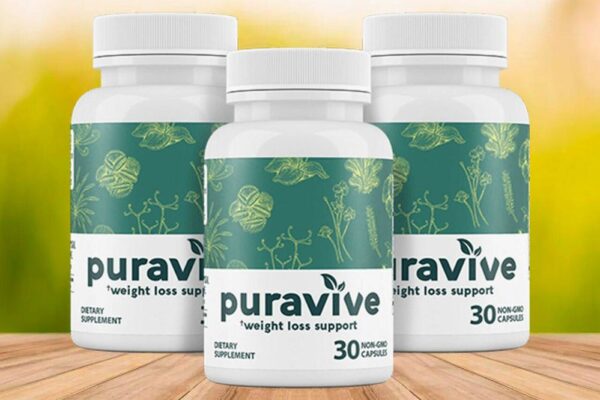 Three bottles of Puravive weight loss support dietary supplement, each containing 30 non-GMO capsules, displayed on a wooden surface with a blurred green and yellow background.