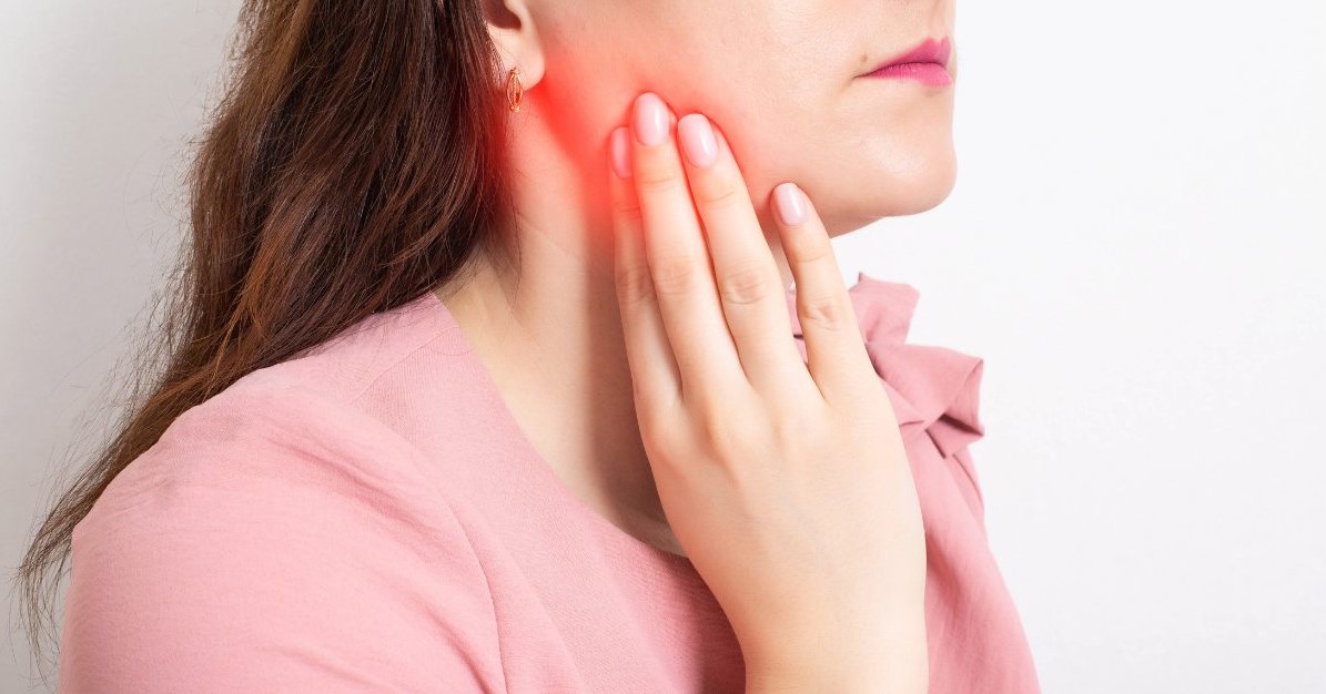 Girl touching Third Molar Pain Relief area