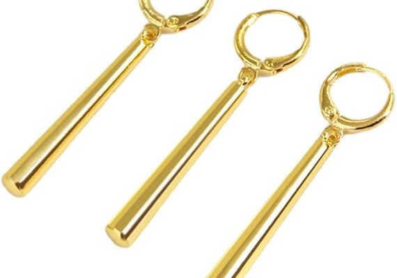 A set of three gold Zoro Earrings with long, sleek pendants, arranged side by side against a white background.