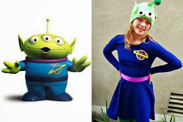 Side-by-side image featuring the green three-eyed alien character from Toy Story Alien Costume on the left and a person dressed in a costume inspired by the character on the right. The costume includes a blue dress with a planet emblem, a pink belt, green leggings, and a green hat resembling the alien's head with three eyes and an antenna.