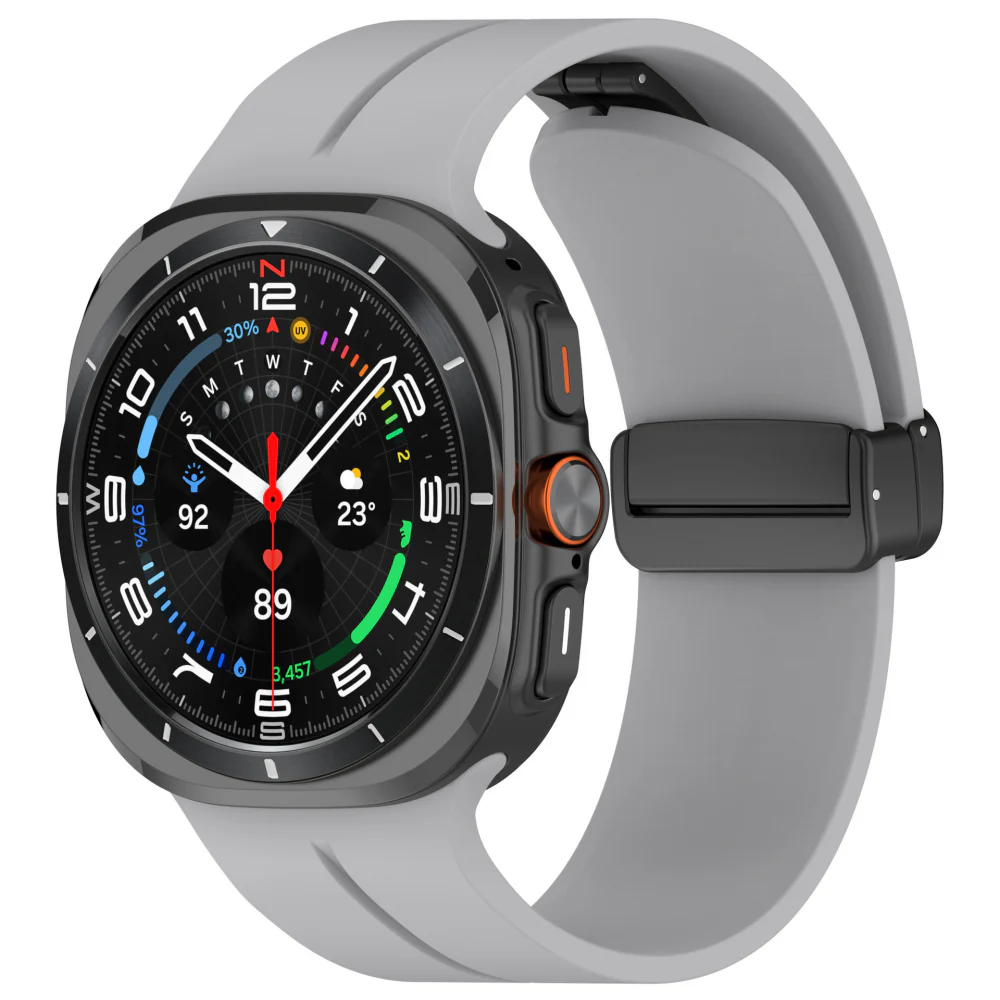 A modern smartwatch with a black round display and a gray Galaxy Ultra Magnetic Band, showing fitness and weather data on the screen.