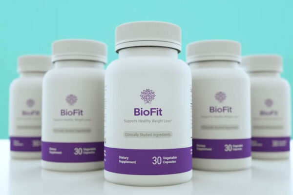 A group of BioFit Reviews dietary supplement bottles displayed against a light teal background. Each bottle contains 30 vegetable capsules and features purple and white labeling. The label states 'Supports Healthy Weight Loss*' with 'Clinically Studied Ingredients' highlighted. The product is designed to aid in weight management and overall health.